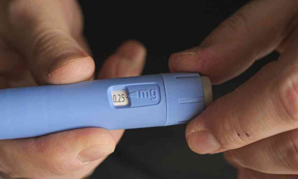 Why do patients prefer medication access via an online pharmacy in the UK?